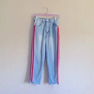 Blue denim jeans with red stripes